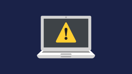 Warning triangle on a Laptop graphic