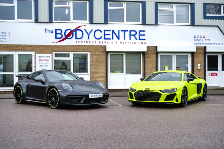 The Bodycentre Ltd with two cars at the front of the building