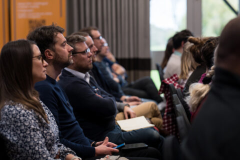 Event attendees sat in a row.