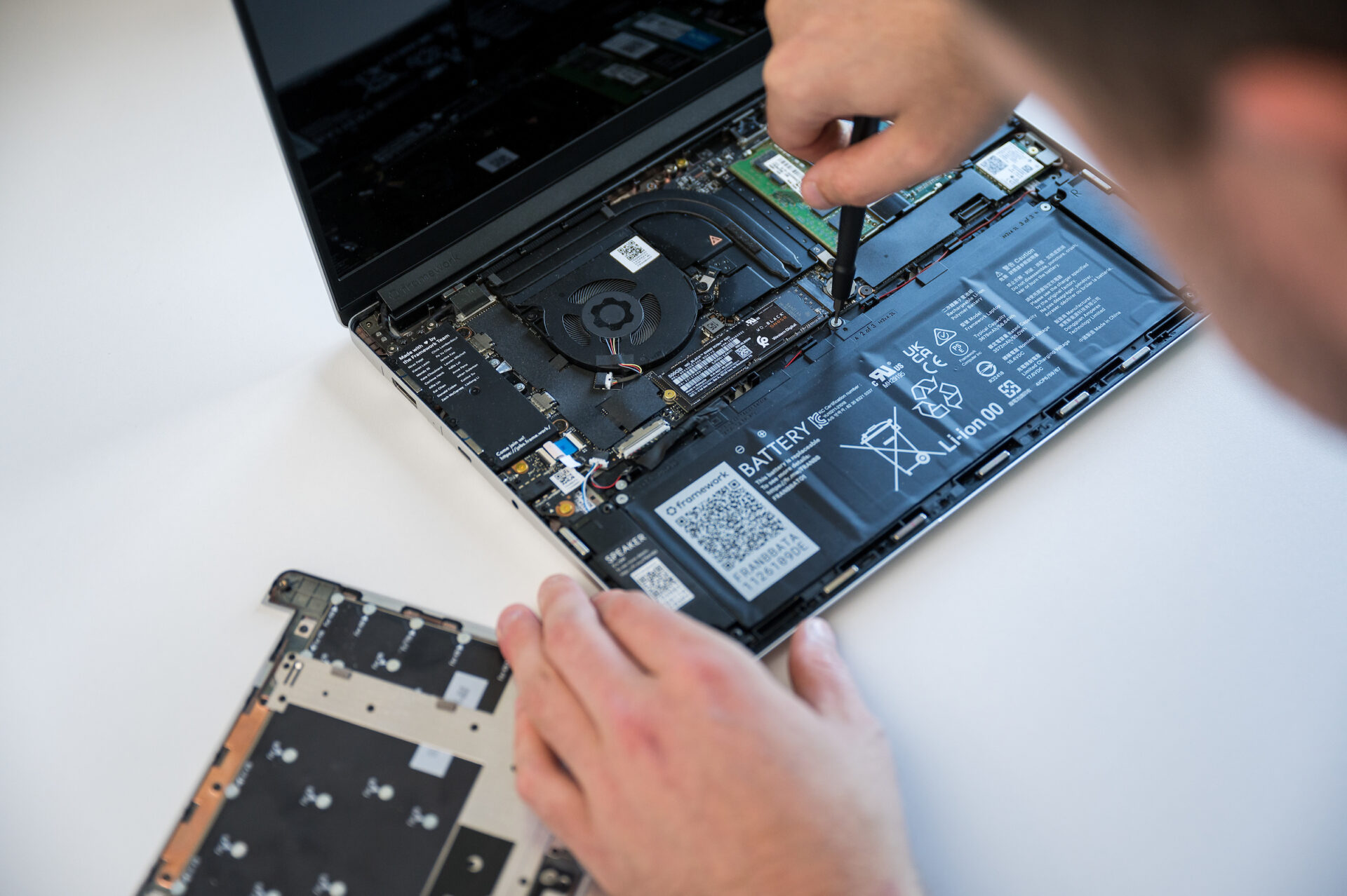 A laptop taken apart for repair