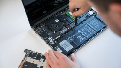 A laptop taken apart for repair